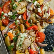 Close up of roasted sheet pan lemon chicken and peppers.