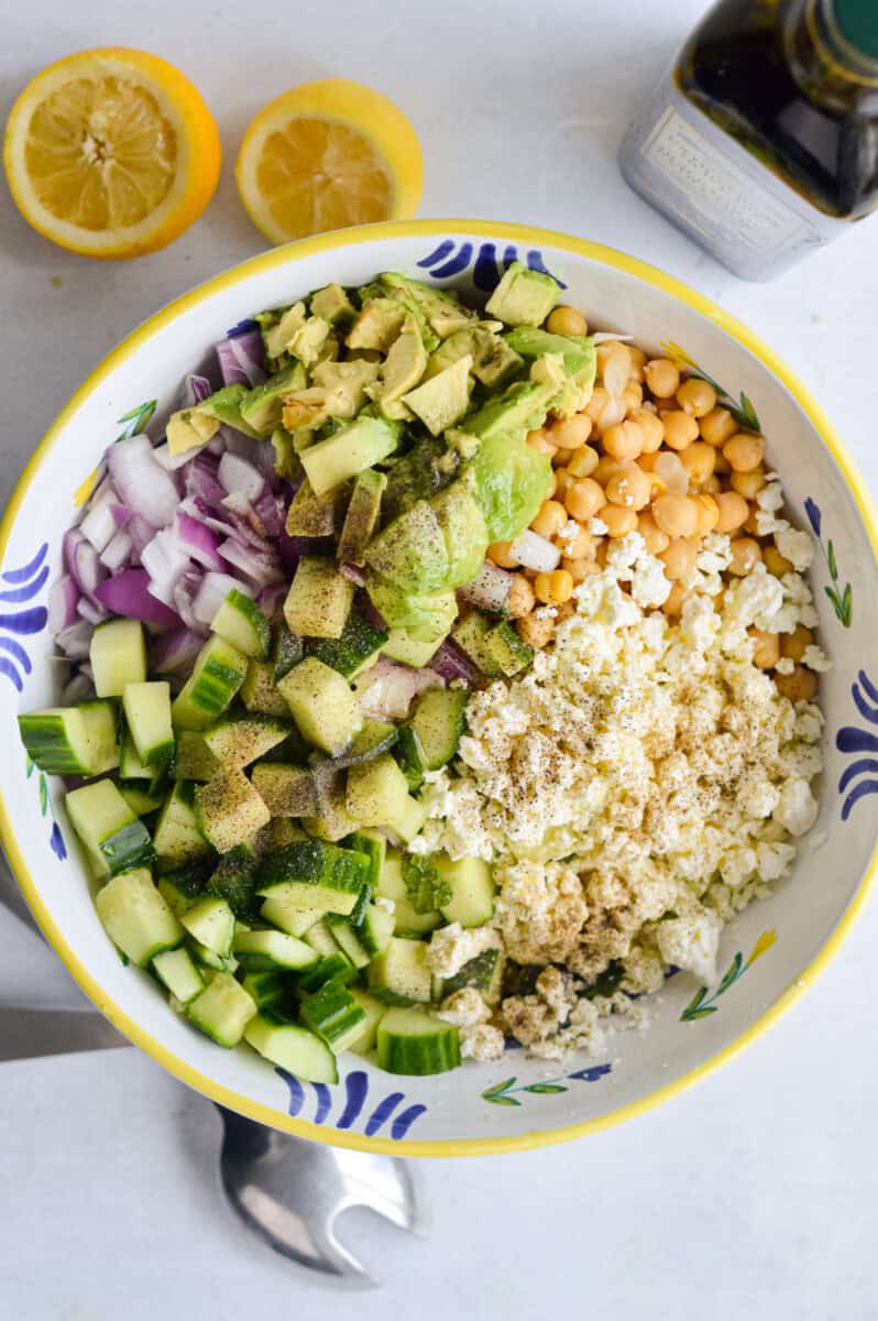 Unmixed cucumber chickpea feta quinoa salad.