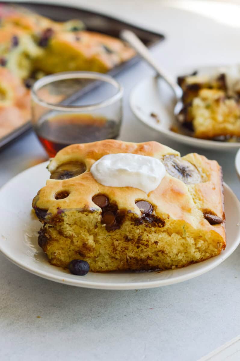 sliced sheet pan pancake topped with greek yogurt