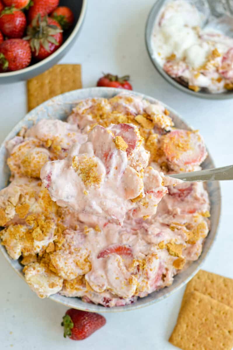 Birds eye of a bowl of strawberry and banana cheesecake salad.