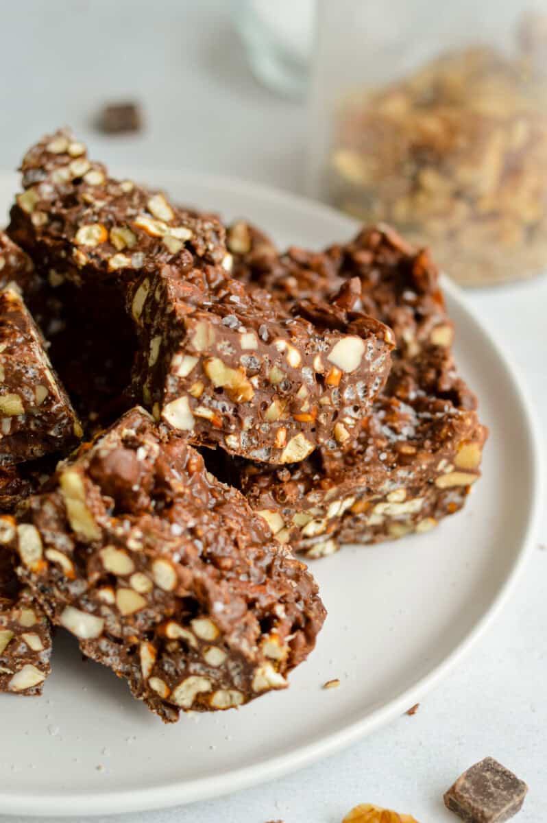 Close up of chocolate peanut butter crunch bars on a plate.
