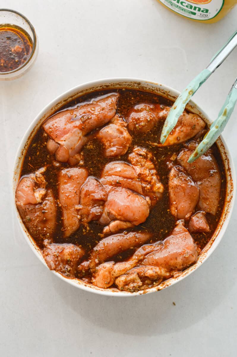 Marinating chicken thighs.