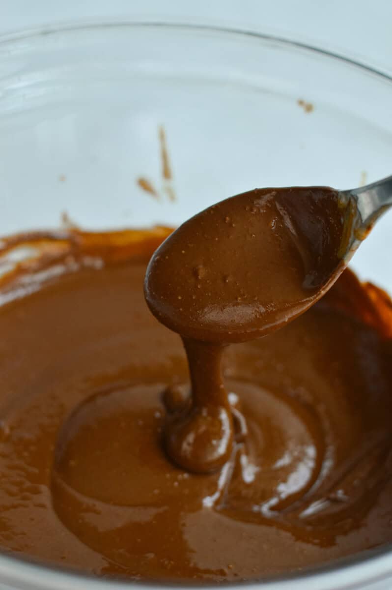 Melting chocolate with peanut butter.