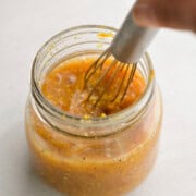 In a small bowl or mason jar, combine orange juice, orange zest, honey, dijon mustard, salt, black pepper and red wine vinegar
