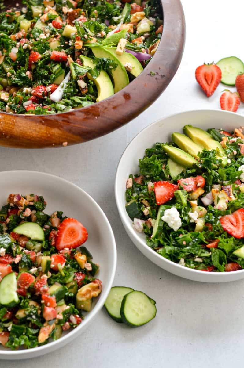 Serving bowls of strawberry and cucumber salad. 
