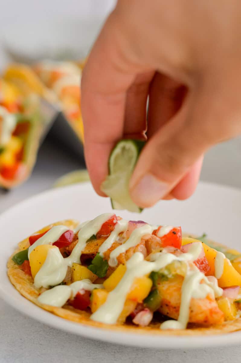 Squeezing a lime on fish tacos.