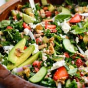 Bowl of strawberry and cucumber salad with hot honey halloumi.