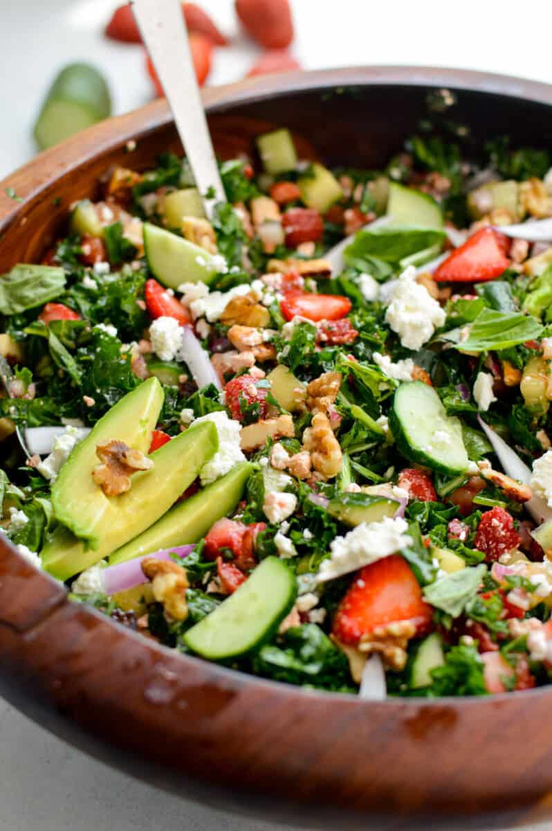 Bowl of strawberry and cucumber salad with hot honey halloumi.