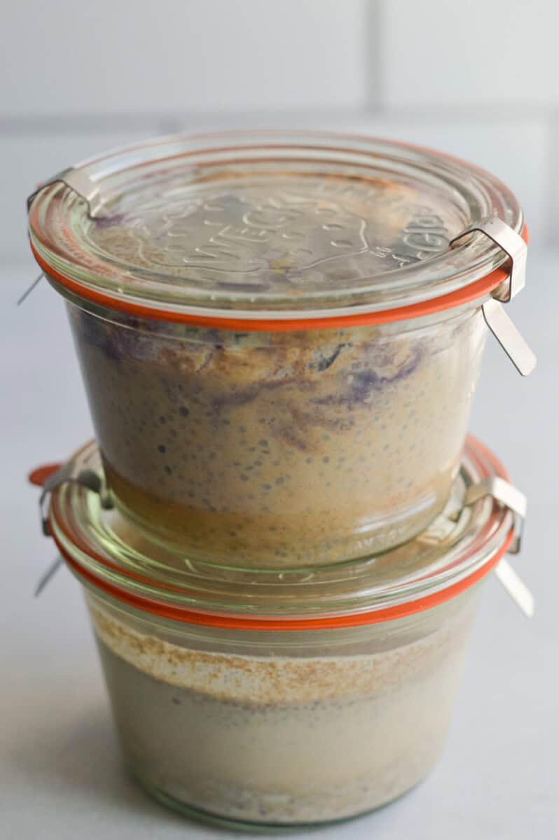 Two glass jars of chia pudding stacked.
