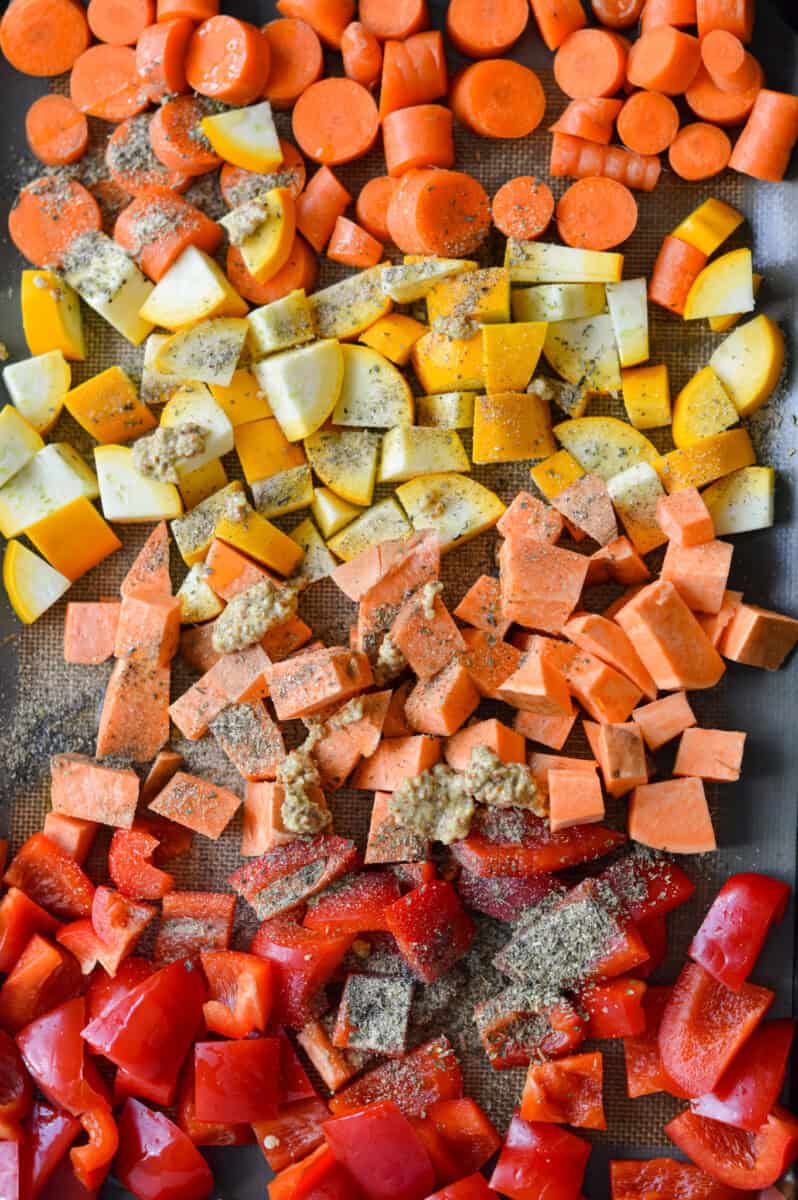 Seasoning vegetables on a pan.