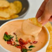 Dipping a chip in high protein cottage cheese queso.