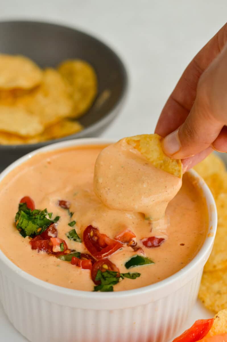 Dipping a chip in high protein cottage cheese queso.