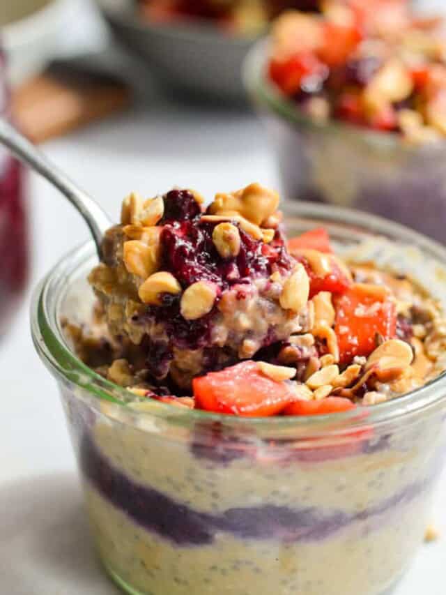 Scooping a bite of pb and j overnight oats.