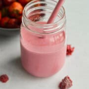 Mason jar and straw with easy fruit smoothie recipe.