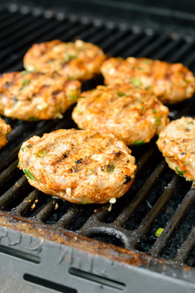 Grilling spicy chicken burgers.