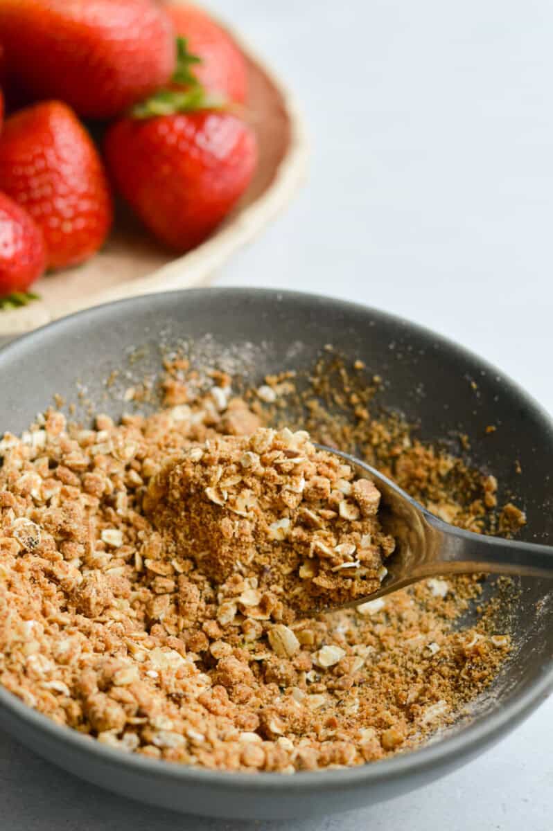 Mixing together crumble topping.