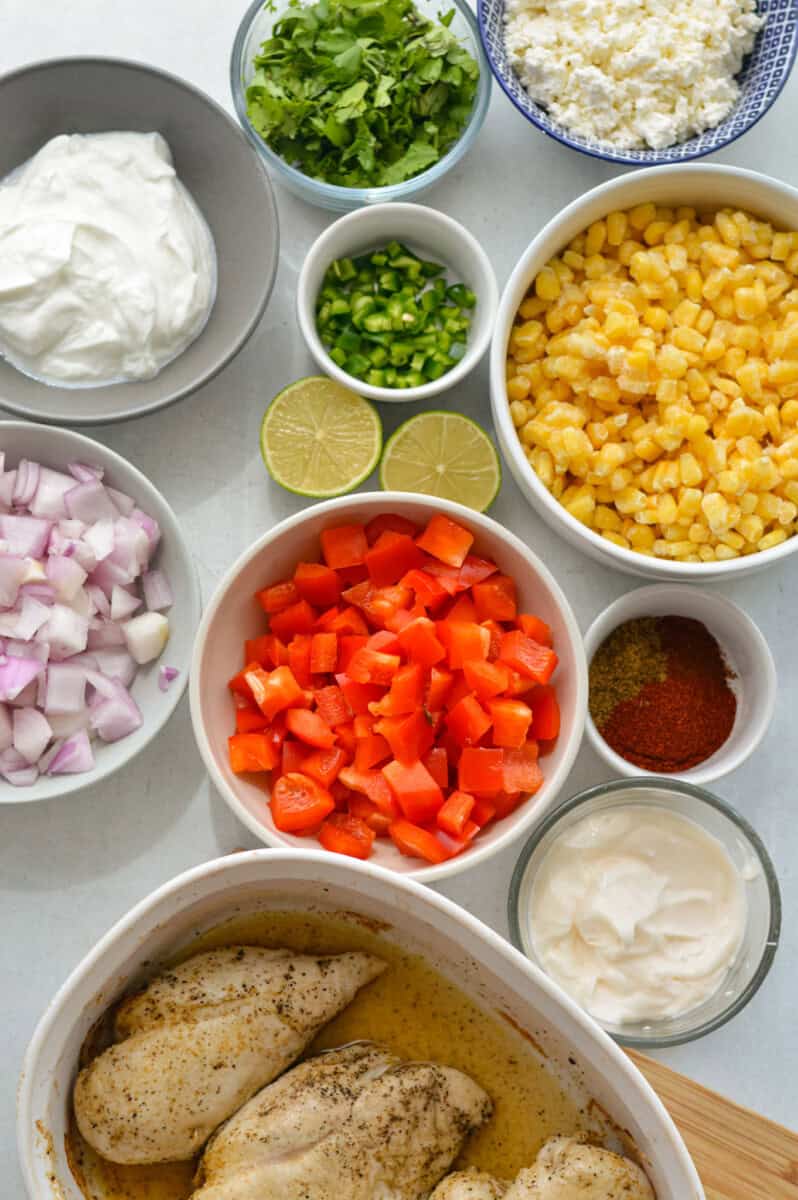 Ingredients including corn, jalapeno, red onion, red pepper, spices, mayo, chicken, greek yogurt and lime.