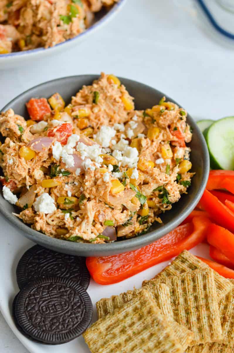 Snack plate with Mexican chicken salad, bell peppers and crackers.