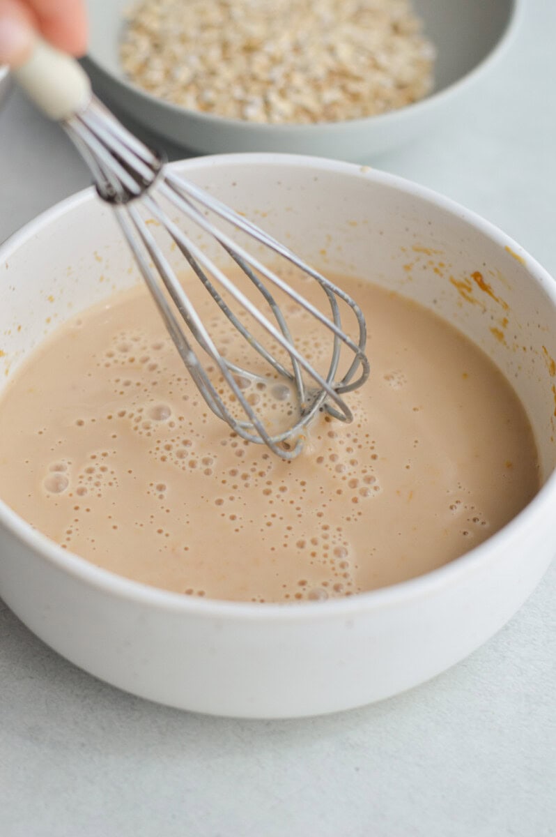 Whisking together peanut butter overnight oats.