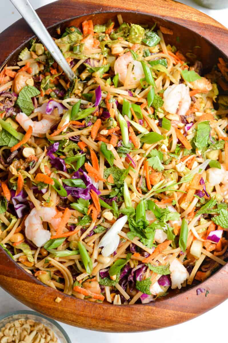Mixing a spring roll salad.