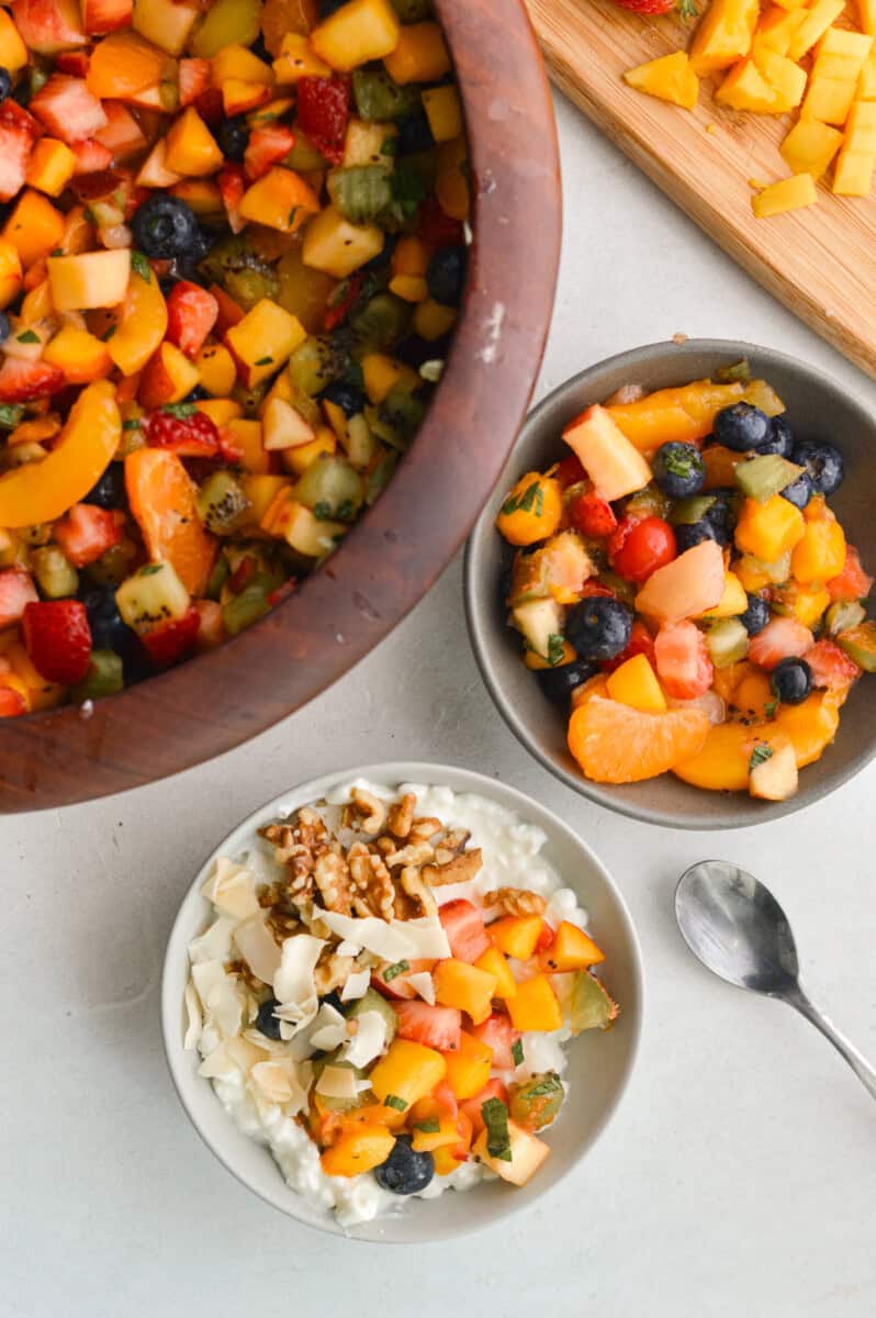 Serving bowls of fruit cocktail salad.