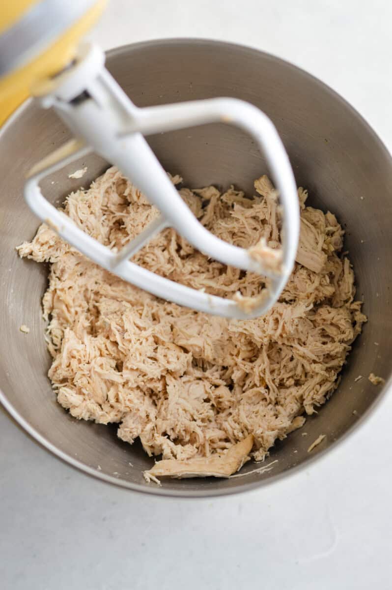Shredding chicken in a stand mixer.