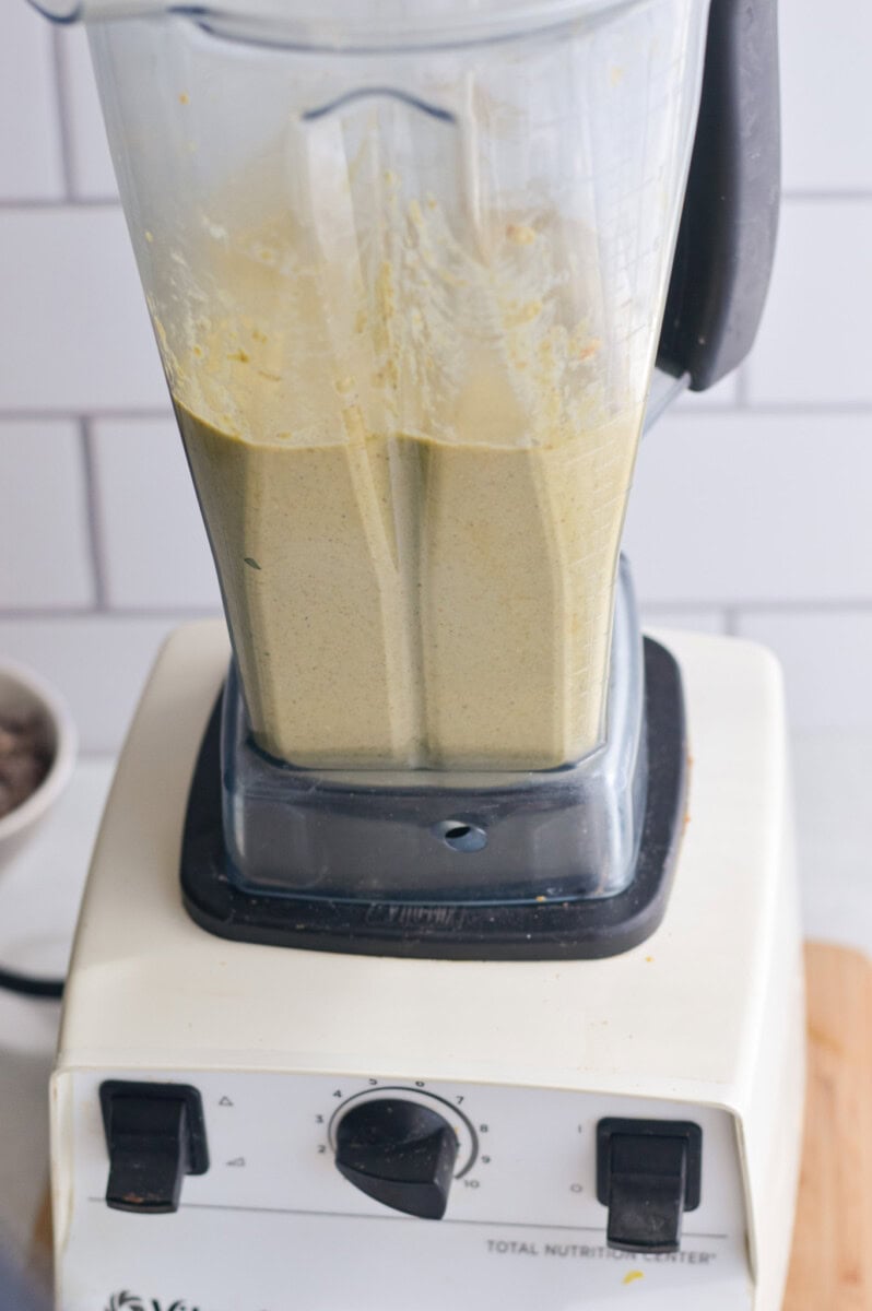 Blending the batter for a zucchini loaf.