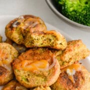 Plate of cheesy broccoli bites.