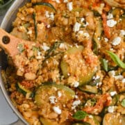 Birds eye of cheesy white bean tomato bake with feta on top.