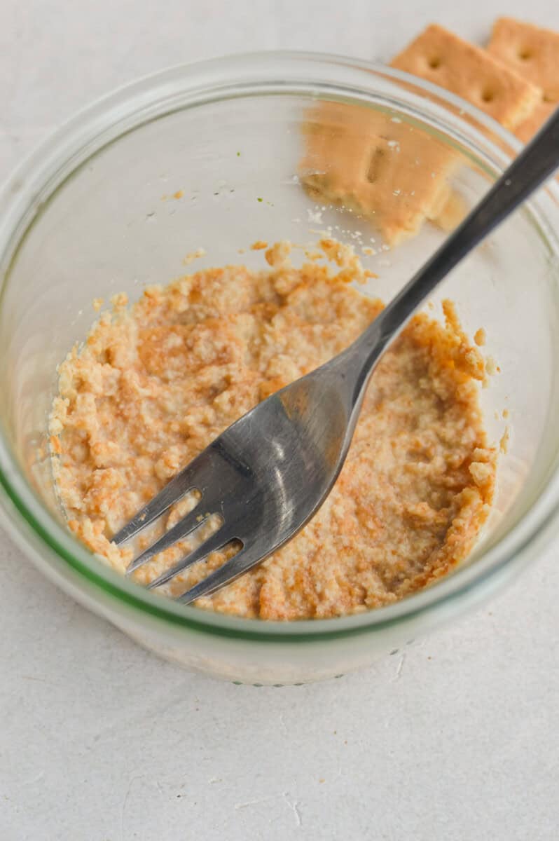 Making graham crust on bottom on a glass jar.
