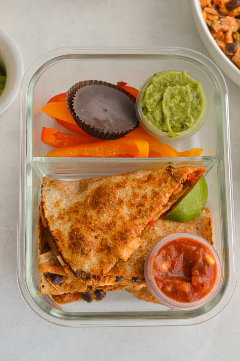 BBQ chicken and black bean quesadilla in an adult lunchable with guac, salsa and carrot sticks.