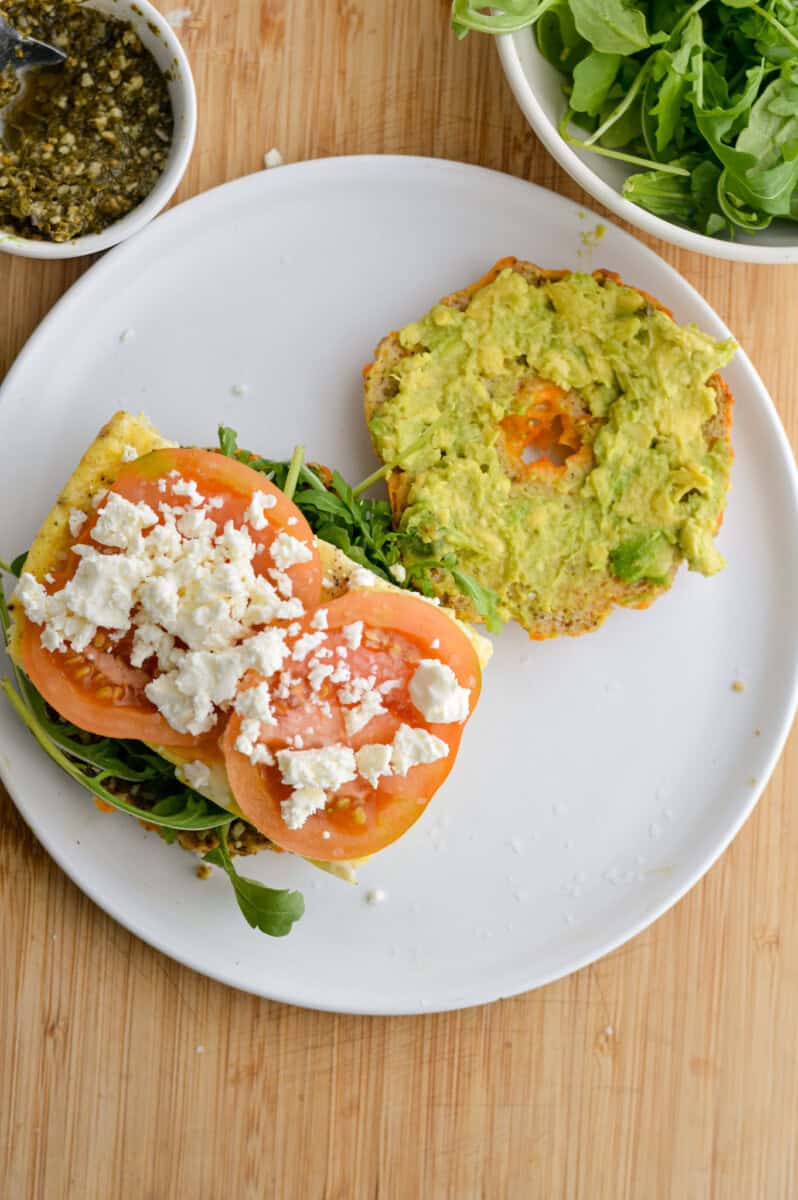 Open faced bagel breakfast sandwich.