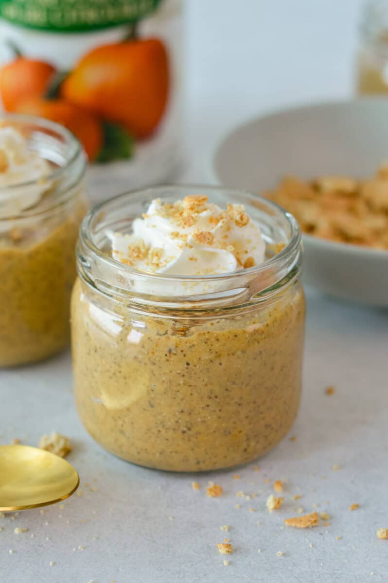 Adding whipped cream to pumpkin pie chia pudding.
