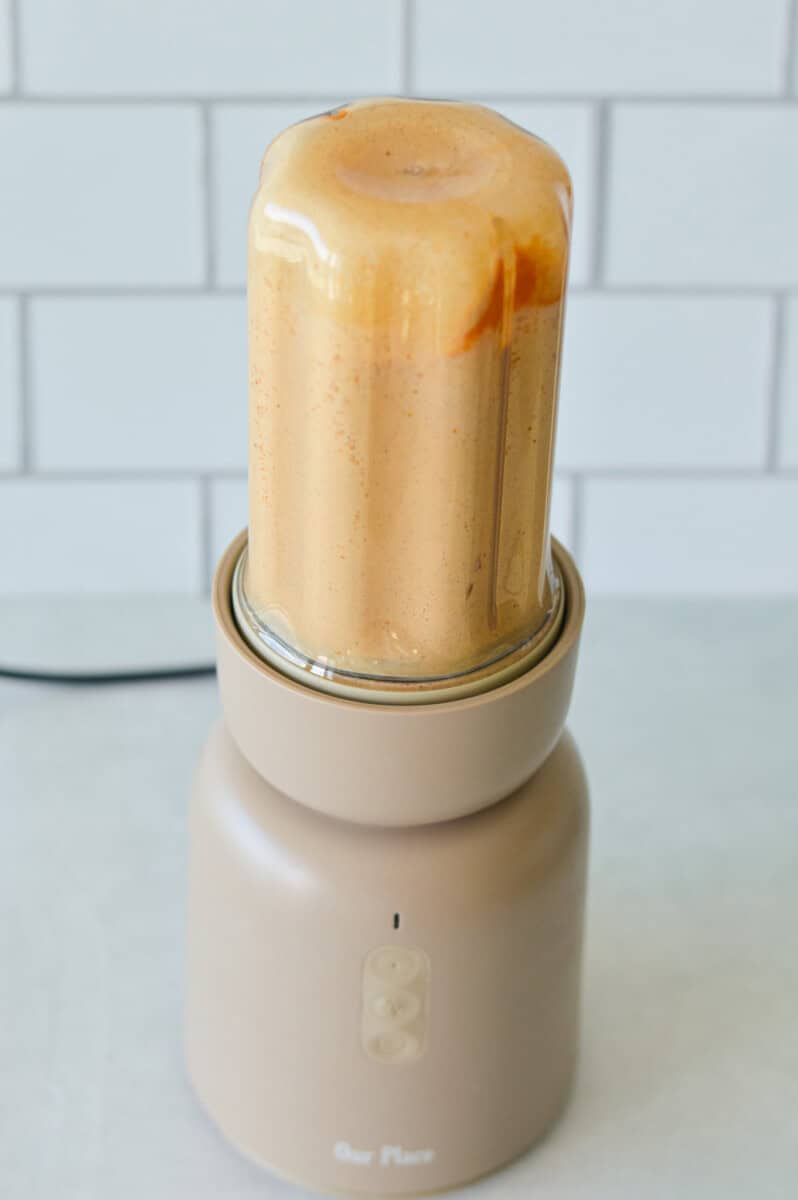 Blending pumpkin pie cream cheese dip.