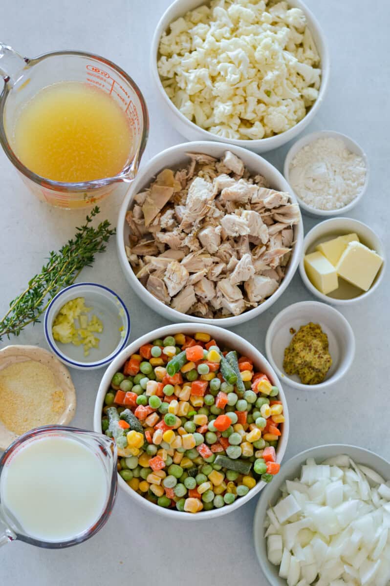 Ingredients including milk, frozen vegetables, chicken, butter, spices, flour and chicken broth.