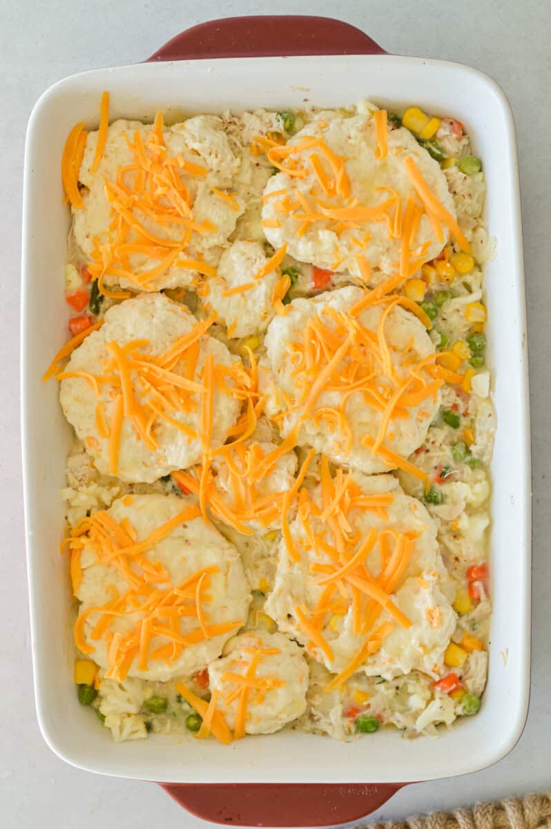 Topping chicken pot pie casserole with cheesy homemade biscuits.