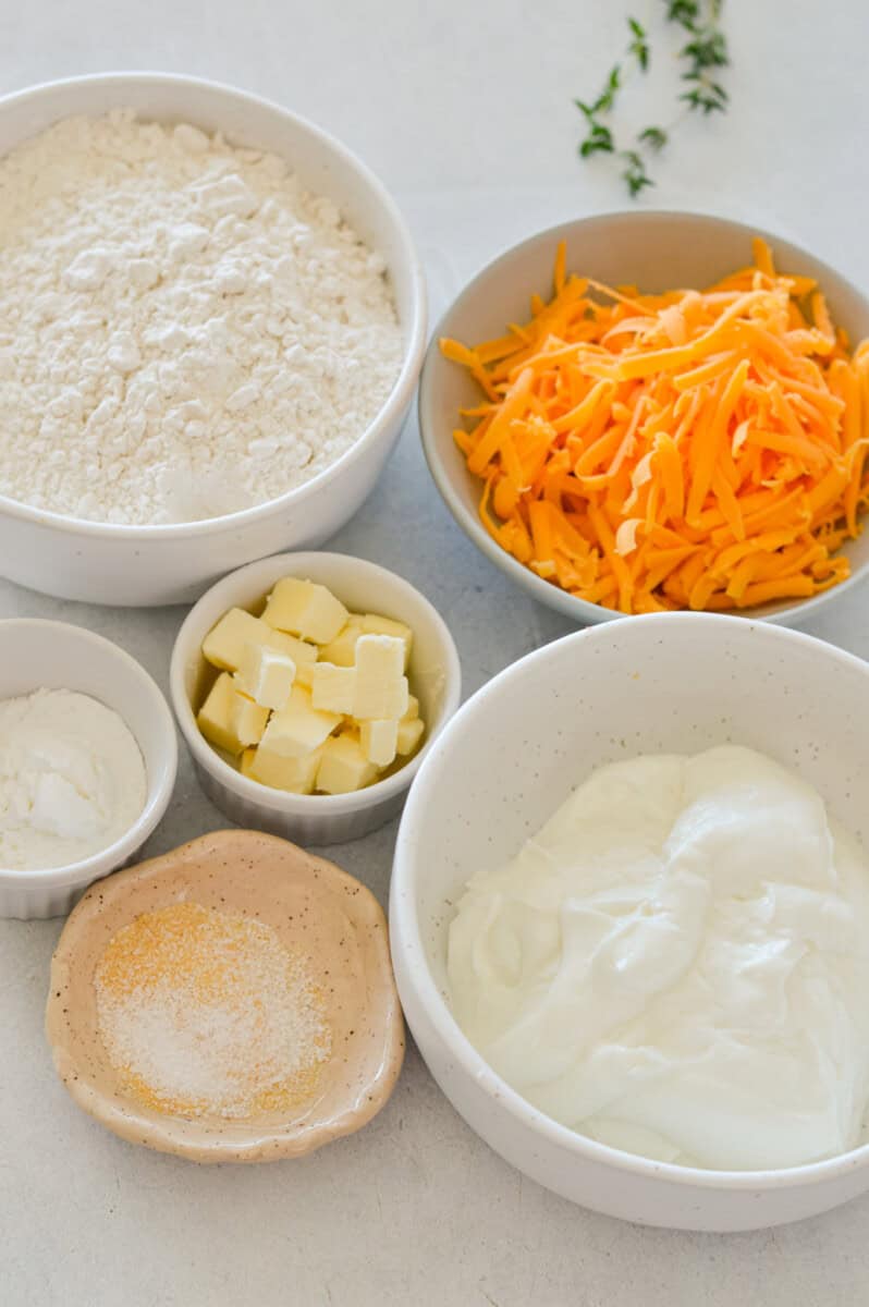 Ingredients including flour, cheese, butter, Greek yogurt, and garlic powder.