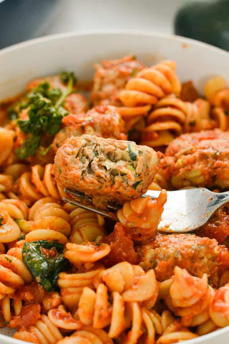 Bowl of pasta with turkey zucchini meatballs.