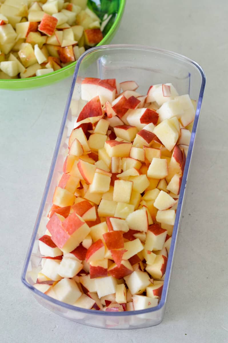 Loaf pan with diced apples.