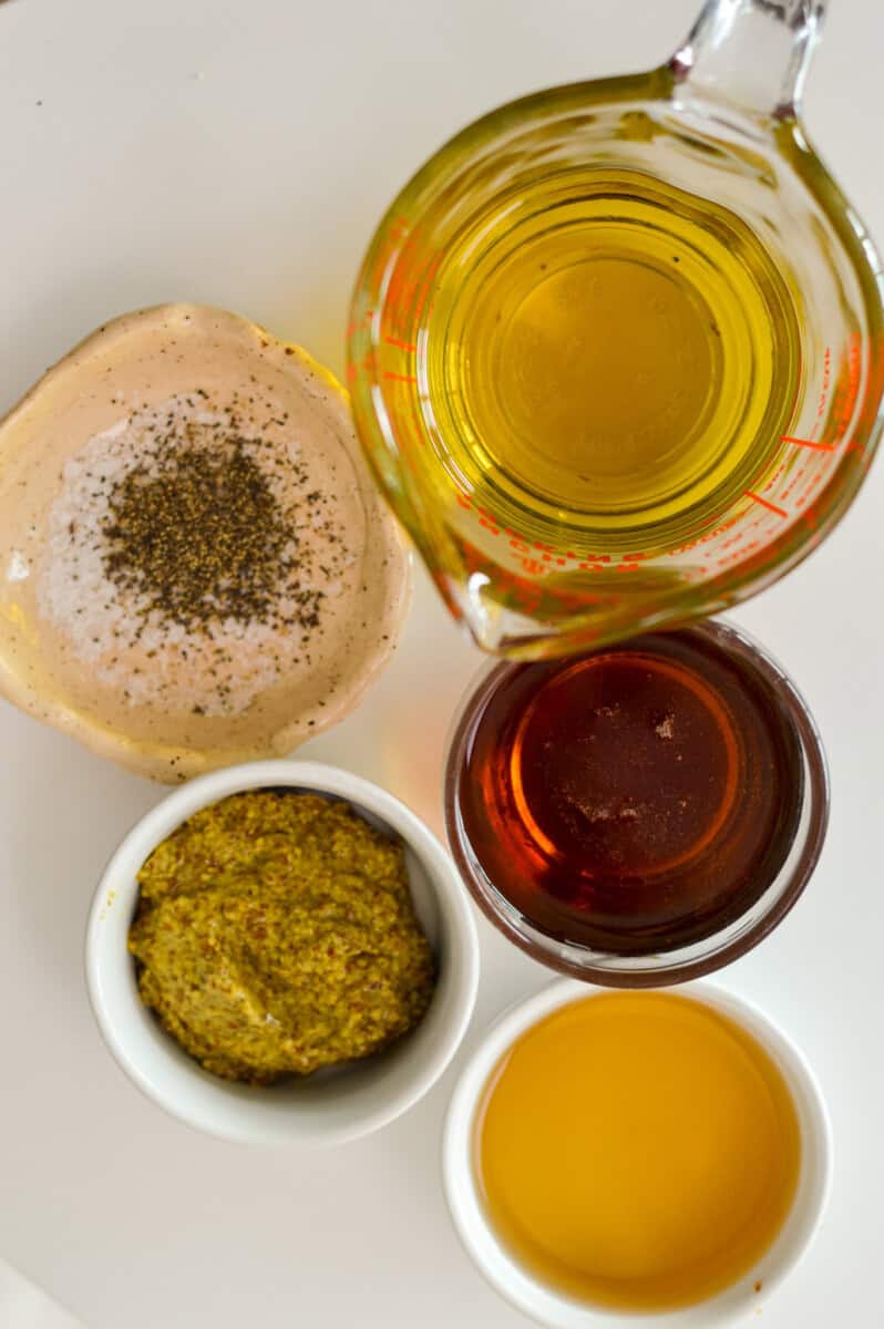 Ingredients including maple syrup, olive oil, dijon mustard and apple cider vinegar.