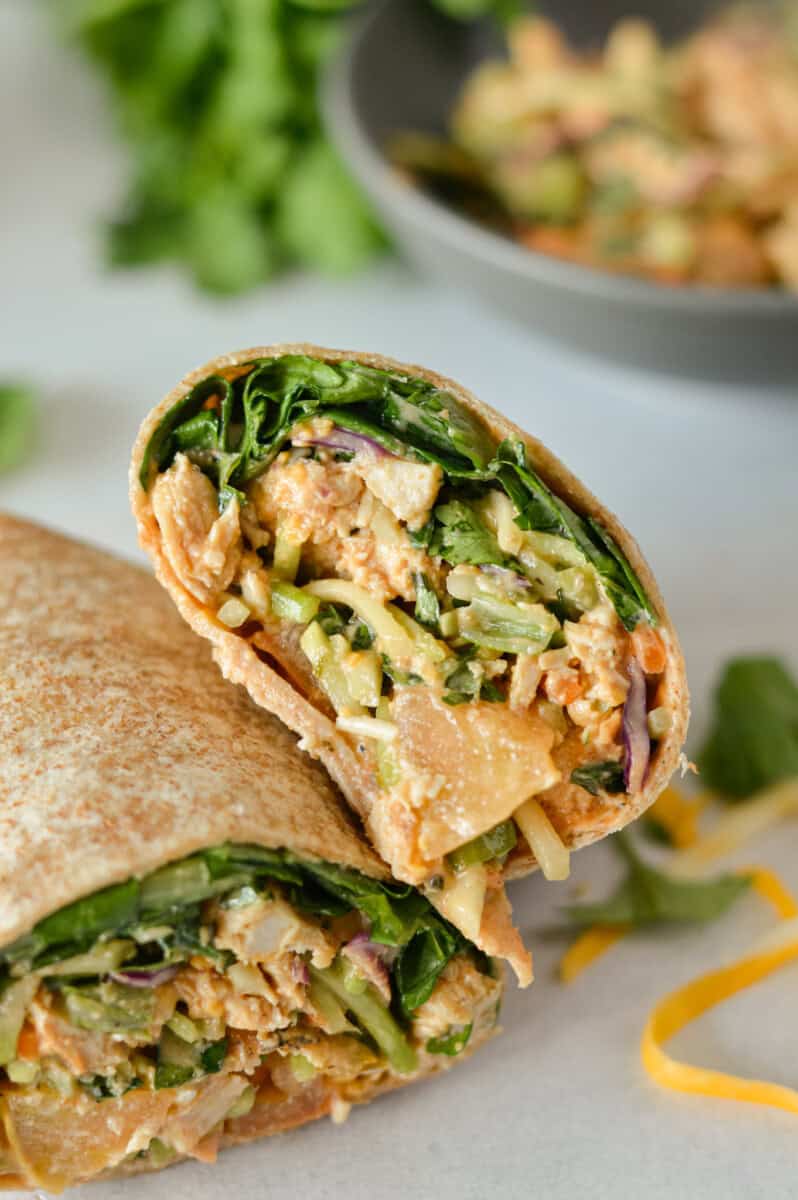 Folded bbq chicken wrap cut in half.