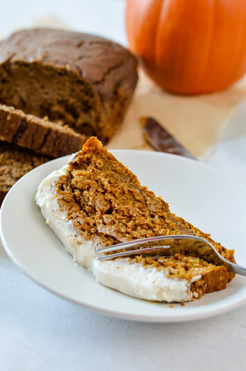 Slice of gluten free pumpkin bread on a plate.