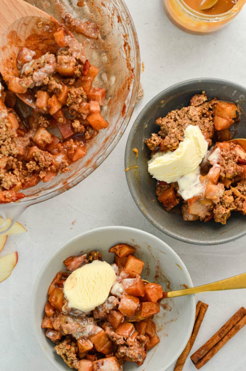 Serving bowls of healthy apple crumble.