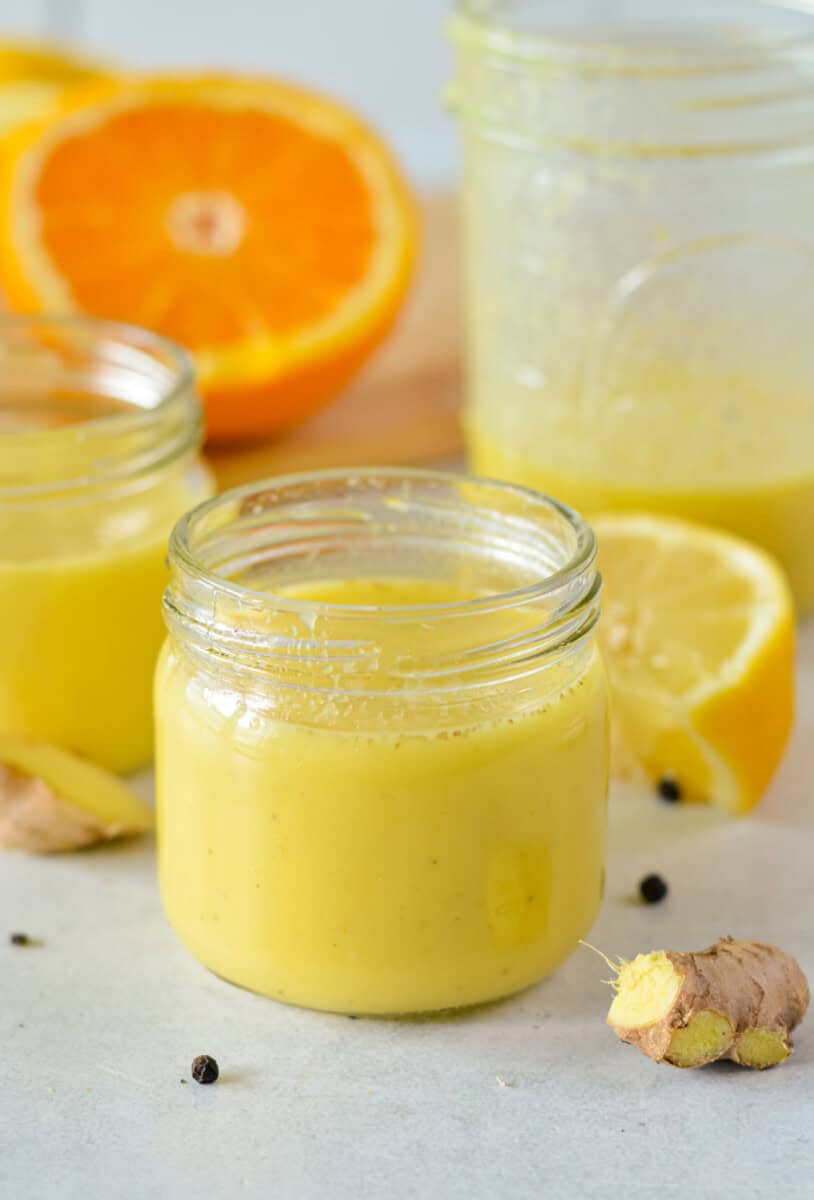 Glass jar with ginger turmeric shot to support immunity.