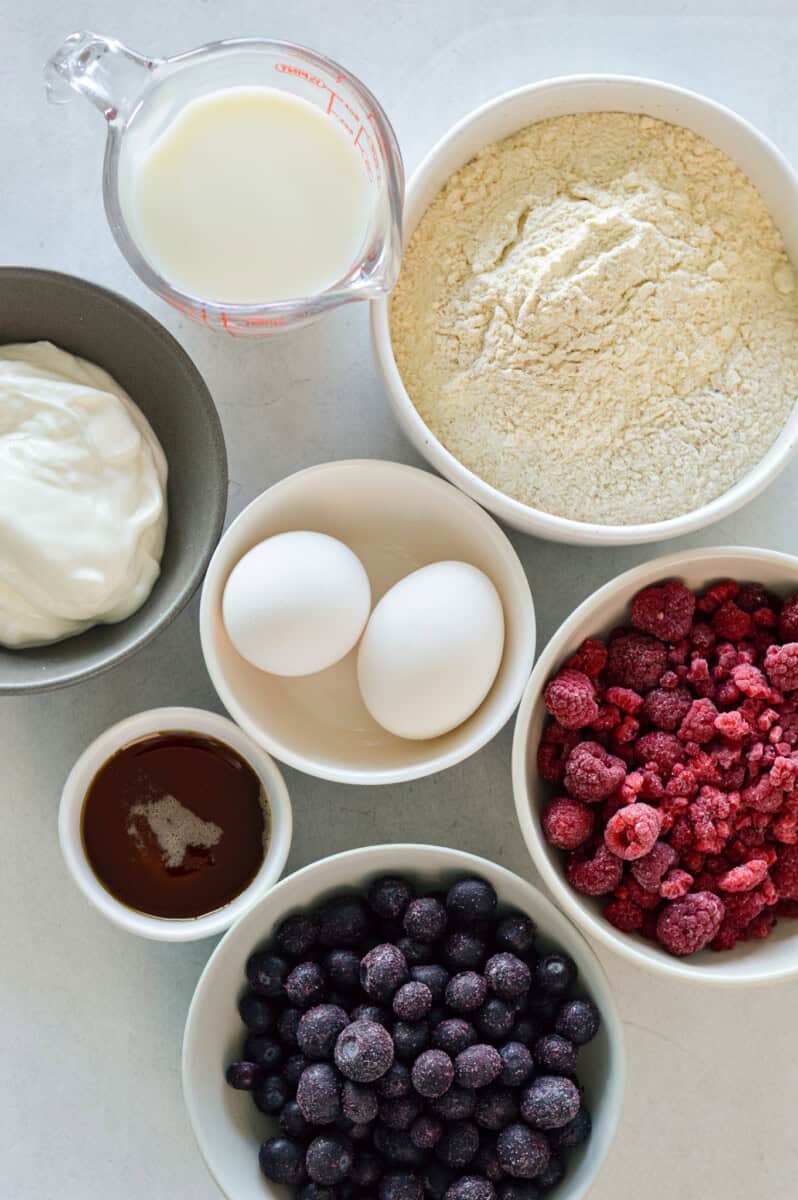 Ingredients including pancake mix, Greek yogurt, eggs, berries, milk and chocolate chips.