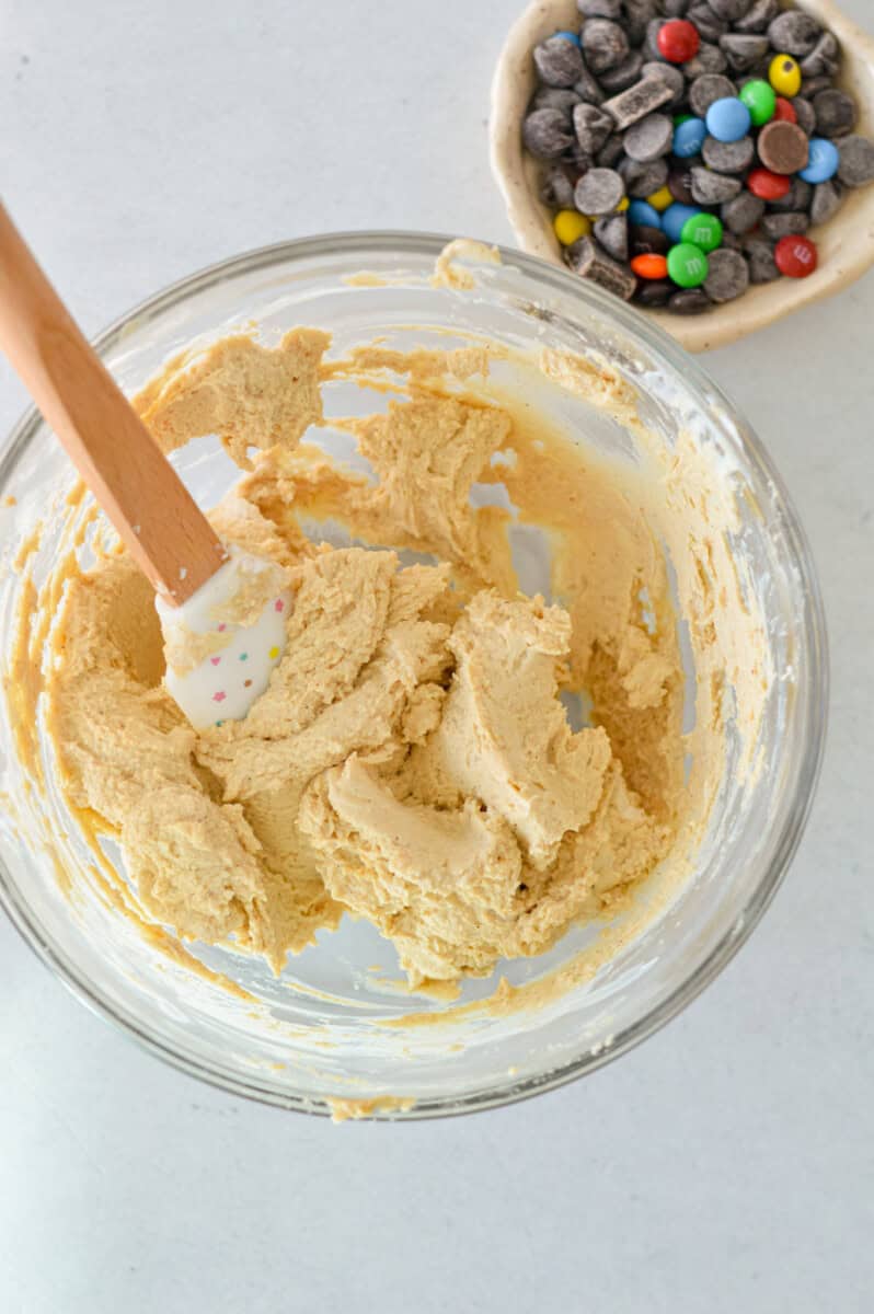 Mixing in protein powder, oat flour and salt for a plain cookie dough base.