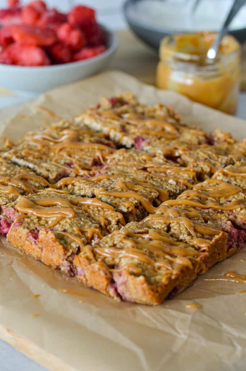 Slicing strawberry oatmeal bars.