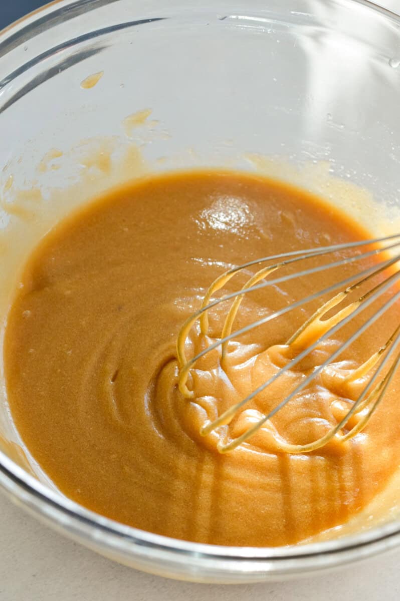 Whisking together sugar and butter.