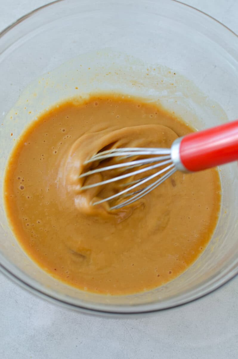 In a large bowl combine peanut butter, honey, milk, vanilla extract and egg. Mix well. 
