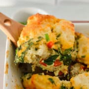 Serving a slice of biscuit breakfast bake.